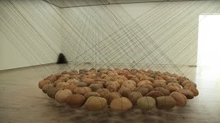 Artist Ken Unsworth installs his work Suspended Stone Circle II [upl. by Akcinahs]